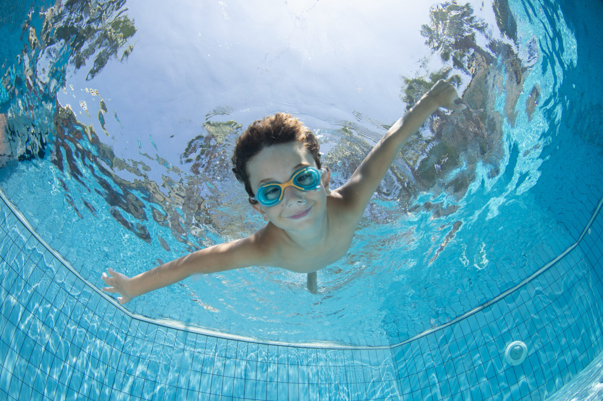 Boy swimming. Underwater photo of a boy swimming.